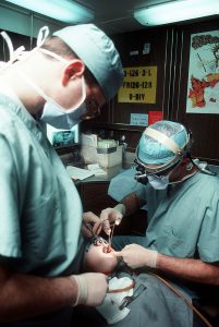 602px-Dental_surgery_aboard_USS_Eisenhower,_January_1990